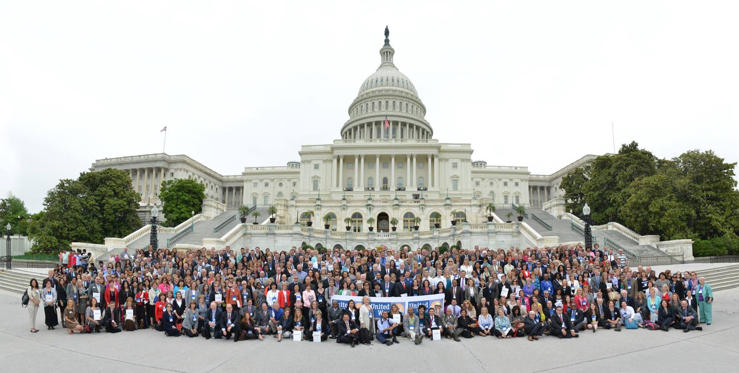 large group of people in front of government building