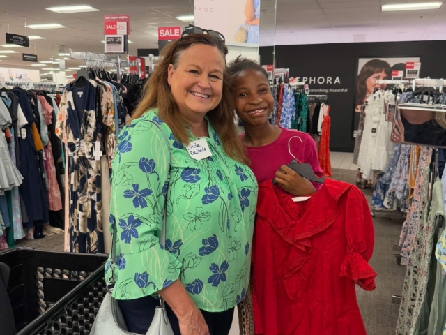 IMG_3213 woman mentor and female teen student shopping for professional clothing